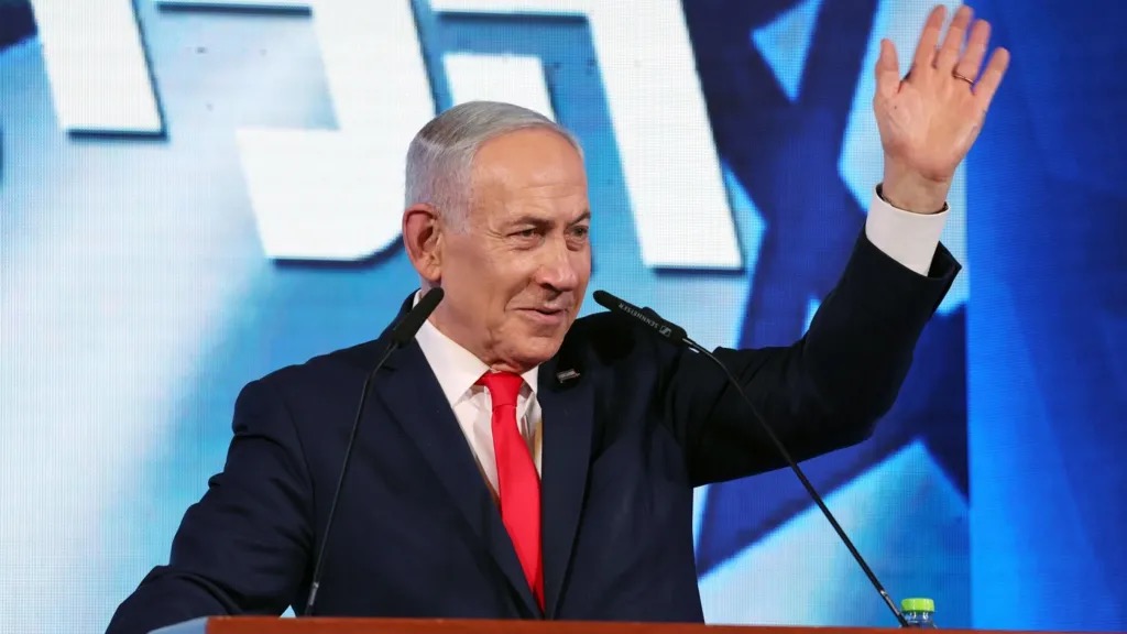Benjamin Netanyahu waving at Likud party headquarters in Jerusalem.
